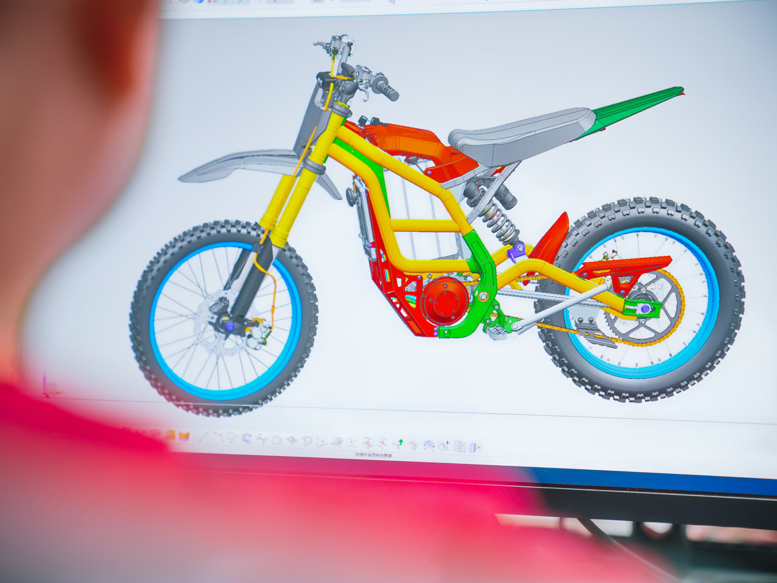 ARKAMOTO product development team reviewing a motorcycle concept